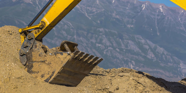 Built structure on land against mountain range