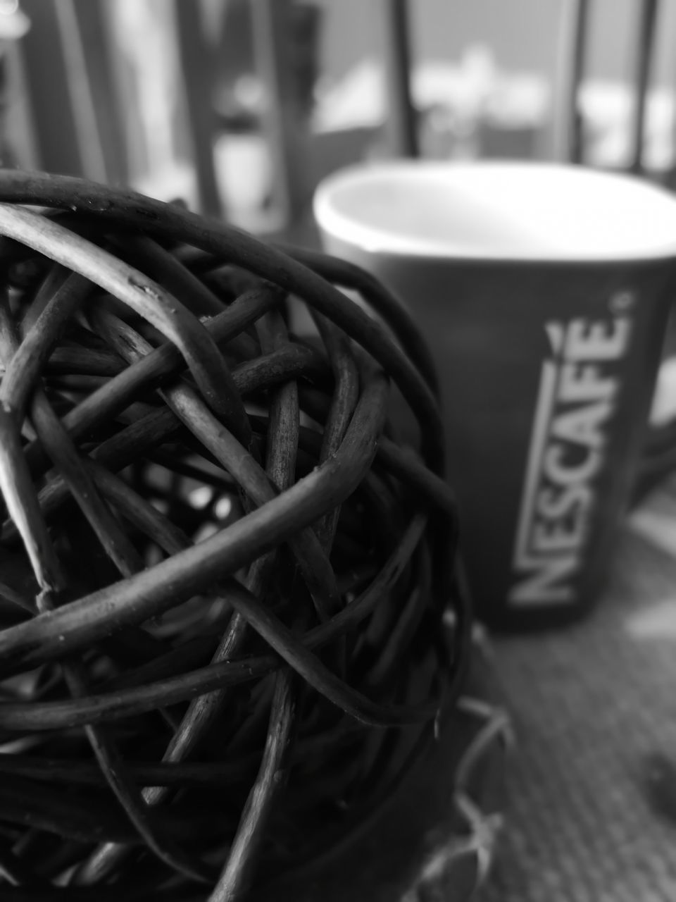 still life, focus on foreground, close-up, communication, indoors, no people, text, food and drink, table, western script, cup, connection, selective focus, food, day, mug, technology, metal, art and craft, large group of objects, crockery
