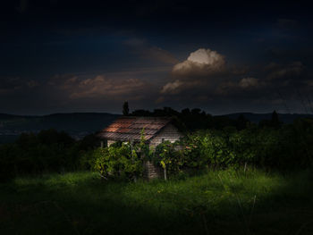 House on field against sky