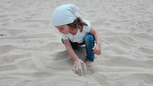 Full length of boy on sand at beach
