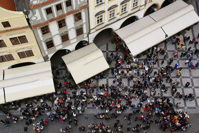 High angle view of people on street against buildings in city
