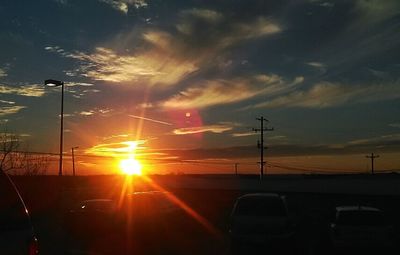 Car on road at sunset