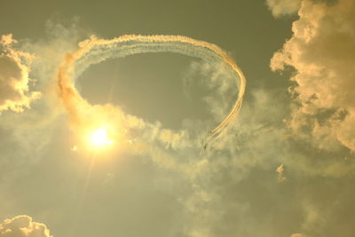 Low angle view of vapor trails against sky