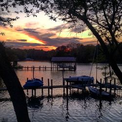 Scenic view of calm lake at sunset