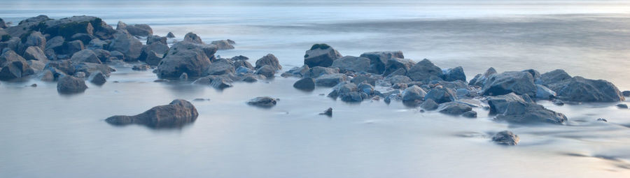 Panoramic view of rocks on beach