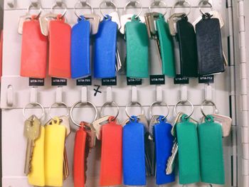 Colorful keys hanging on hooks