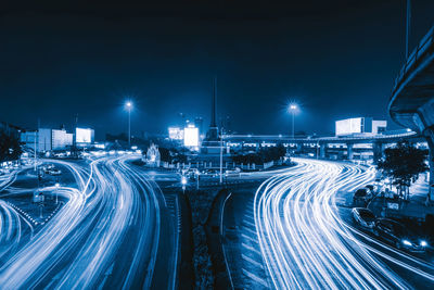 High angle view of light trails on highway at night
