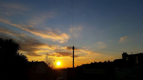 Silhouette of built structure at sunset