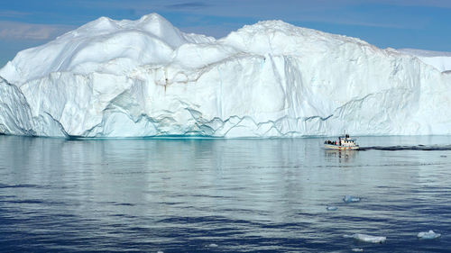 Scenic view of frozen sea against sky