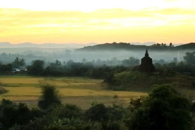 Scenic view of landscape against sky during sunset