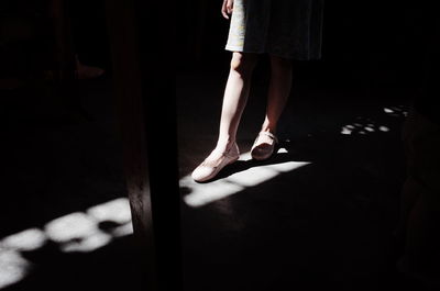 Low section of woman standing on floor