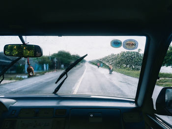 Road seen through car window