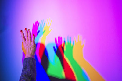 Close-up of multi colored shadows on a wall