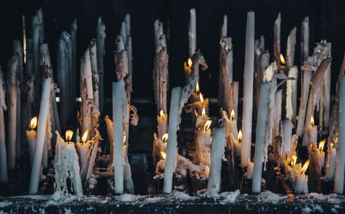 Panoramic view of candles in temple