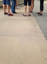 Low section of people standing on floor