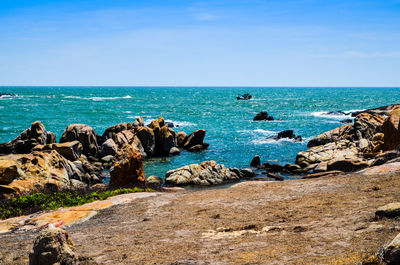 Scenic view of sea against clear blue sky