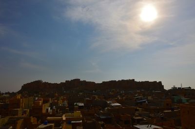 Cityscape against sky during sunset