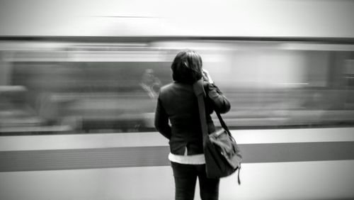 Rear view of senior man at subway station