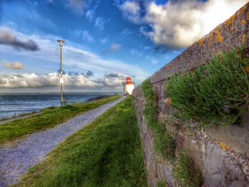 Scenic view of sea against cloudy sky