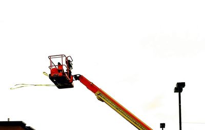 Low angle view of construction site against sky