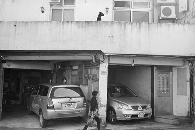 Car parked on road against buildings