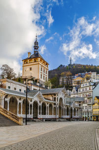 Buildings in city against sky