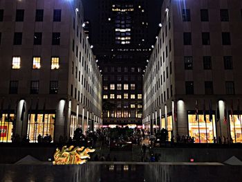 Buildings in city at night