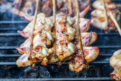 Close-up of meat on barbecue grill