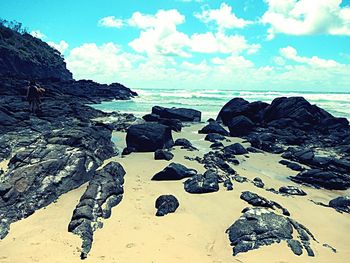 Scenic view of sea against cloudy sky