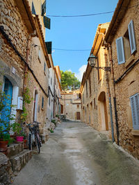 Narrow alley amidst buildings in town