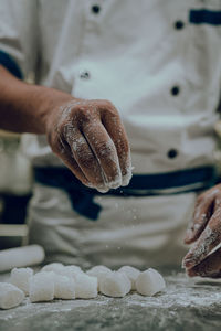 Midsection of chef preparing food