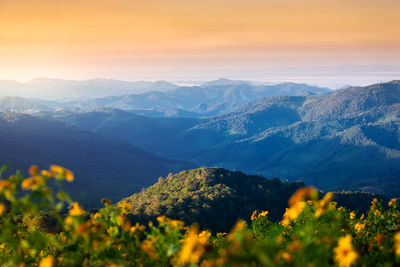 Scenic view of mountains against sky during sunset