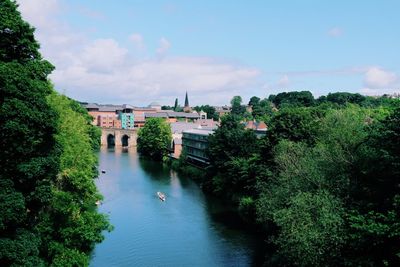 High angle view of river amidst trees against sky