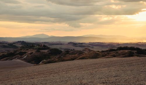 Scenic view of landscape against sky during sunset