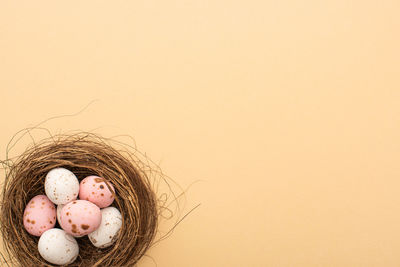 High angle view of easter egg against pink background