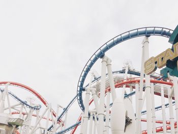 Low angle view of ferris wheel against sky