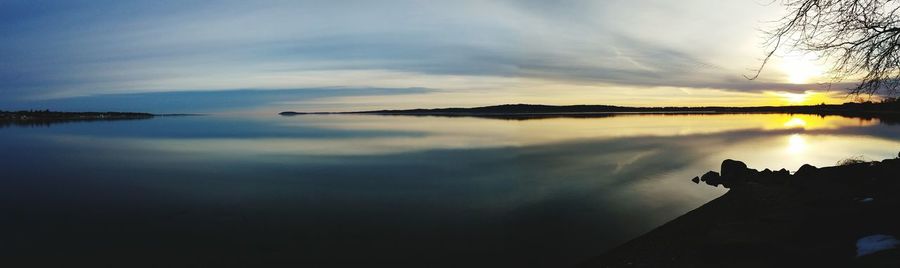 Scenic view of lake against sky during sunset