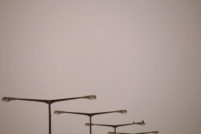 Low angle view of street light against clear sky