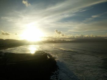 Scenic view of beach against sky during sunset