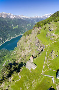 High angle view of green landscape against sky