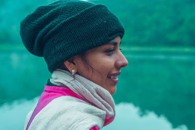 Close-up portrait of woman wearing hat