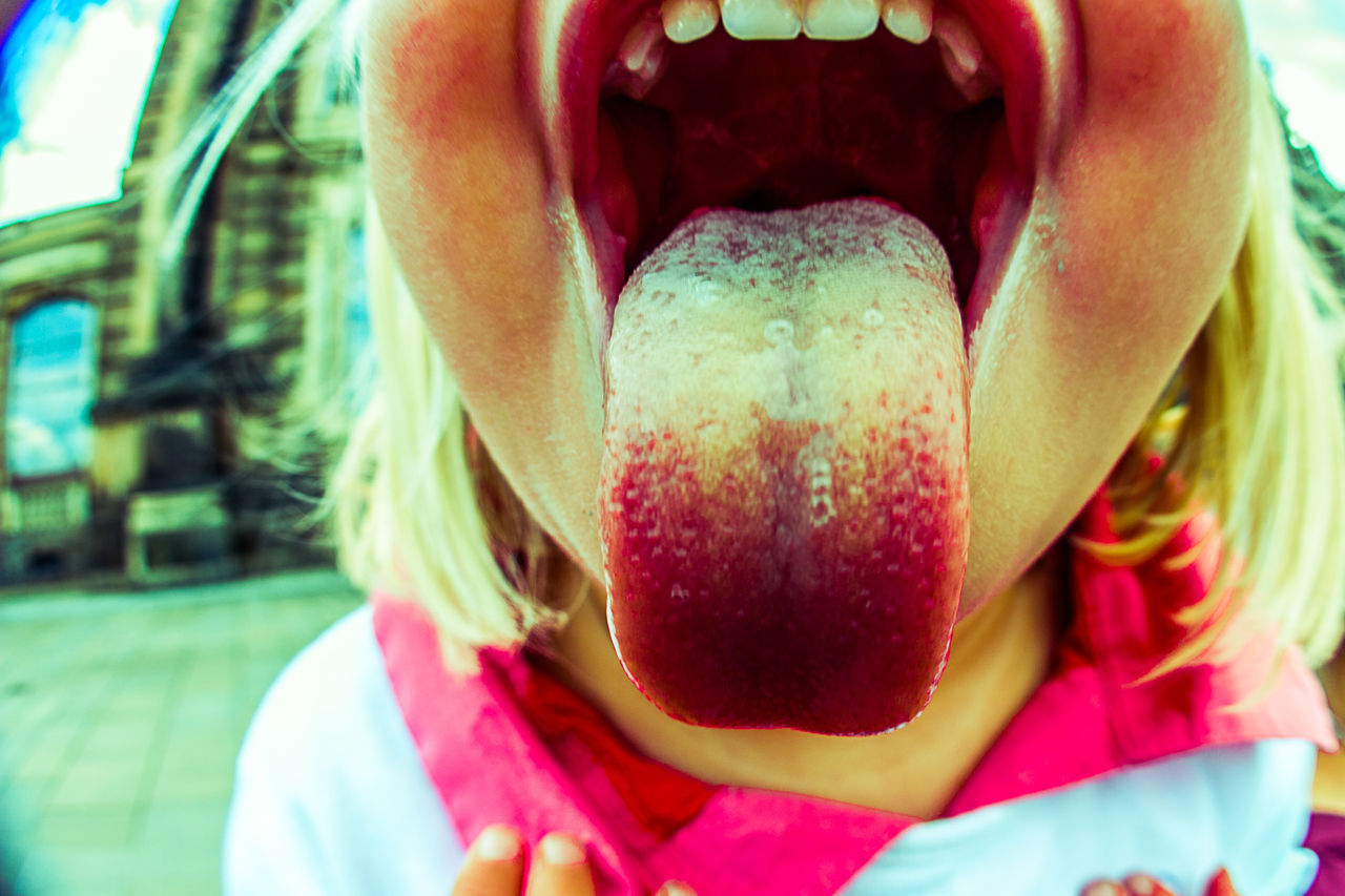 CLOSE-UP OF BABY GIRL IN MOUTH