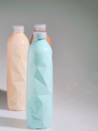 Close-up of glass bottle against white background