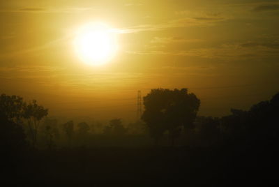 Scenic view of silhouette trees against sky during sunset