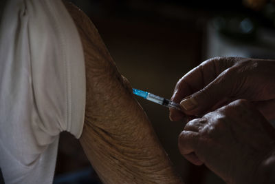 Close-up of man holding hands