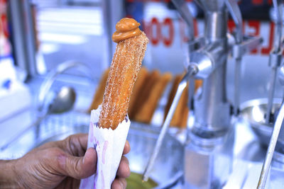 Close-up of man preparing food