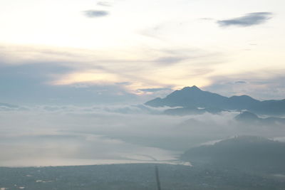 Scenic view of mountains against sky during sunset