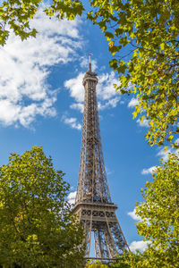 Low angle view of eiffel tower against blue sky