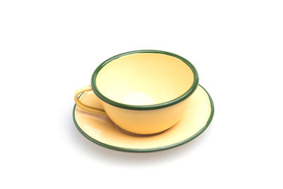 High angle view of tea cup against white background