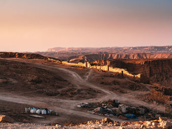 Scenic view of desert against sky during sunset